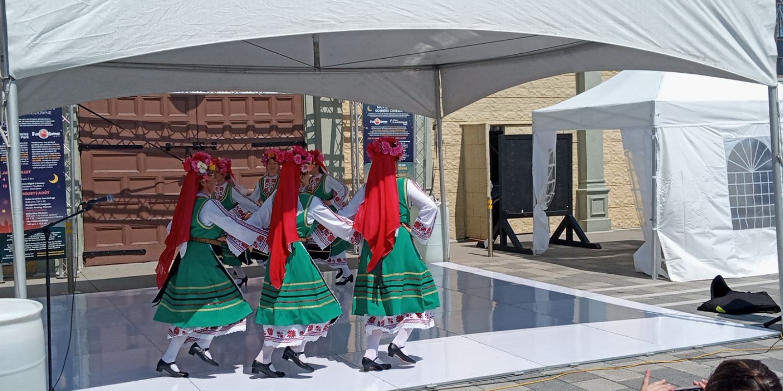 Rodina dancers moving in a circle on stage at the 2024 EU Cultural Festival